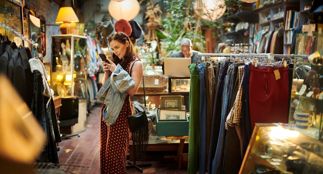 girl in store with pre-loved goods